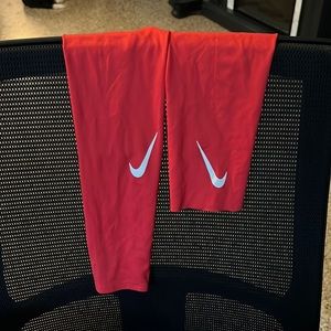 Red Nike arm sleeve.